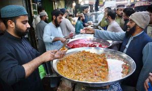 A vendor selling and displaying traditional food item dahi baray during the Holy fasting month of Ramazan at Food Street.