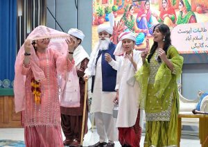 A student performs on stage during the Singing Competition (Folk & Ghazal) at Islamabad Model College for Girls (PG), G-10/4.