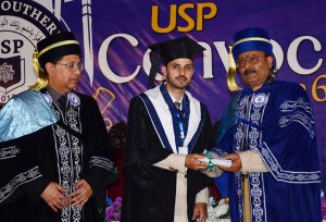Federal Minister and Chairman of the Special Parliamentary Committee on Kashmir, Rana Muhammad Qasim Noon, distributing degrees among students during the convocation at the University of South Punjab