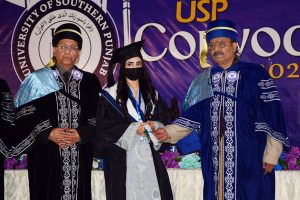 Federal Minister and Chairman of the Special Parliamentary Committee on Kashmir, Rana Muhammad Qasim Noon, distributing degrees among students during the convocation at the University of South Punjab