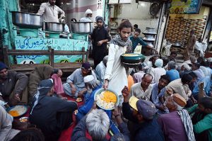 People gather for free Iftar at Pukka Fort Road during the holy month of Ramazan-ul-Mubarak.
