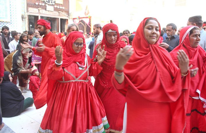 Devotees performing dhamal at the shrine of Lal Shahbaz Qalandar on last day of 774th Urs celebration