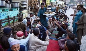 People gather for free Iftar at Pukka Fort Road during the holy month of Ramazan-ul-Mubarak.