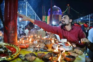 Devotees light oil lamps at shrine of Lal Shahbaz Qalandar on the occasion of 774th Urs celebration