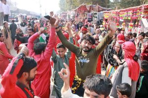 Devotees performing dhamal at the shrine of Lal Shahbaz Qalandar on last day of 774th Urs celebration