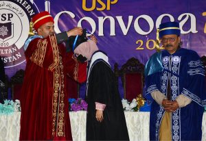 Provincial minister for education Punjab Rana Sikandar Hayat distributing medals among students during the convocation at the University of South Punjab