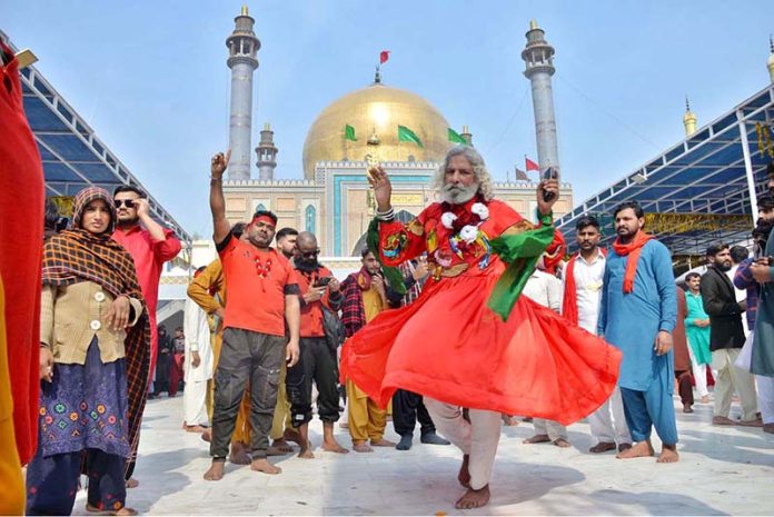 Devotees performing dhamal at the shrine of Lal Shahbaz Qalandar on the occasion of 774th Urs celebration