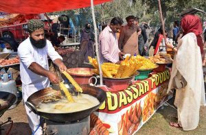 A local vendor prepares crispy potato chips ahead of iftar during the Holy month of Ramazan.