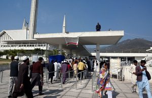 People undergo security checks before entering Faisal Masjid for the first Friday prayers of Ramazan ul Mubarak in the Federal Capital.