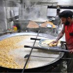 Workers busy in frying traditional food Pakoriyaa mostly used in Dahi Bhalle during the holy fasting month of Ramazan