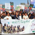 President of Kissan Ittehad, Khalid Mehmood Khokhar, leads a walk rally to show solidarity with the Pakistan Armed Forces.