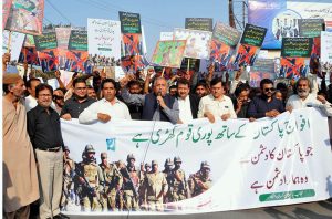 President of Kissan Ittehad, Khalid Mehmood Khokhar, leads a walk rally to show solidarity with the Pakistan Armed Forces.