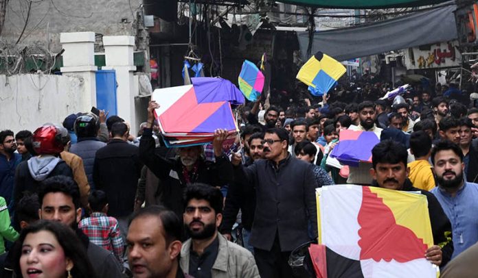 A large number of people purchase kites in connection with the upcoming Basant festival in the provincial capital