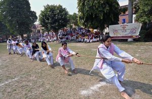 Students pull with all their force to win in the inter-collegiate tug-of-war organized by the Education Board at Government Degree College, Farooq Colony.