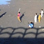 Youngsters are playing near Rice Canal in the evening.