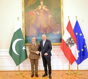 Prime Minister Muhammad Shehbaz Sharif and Austrian Chancellor Christian Stocker shaking hands in Austrian Federal Chancellery.