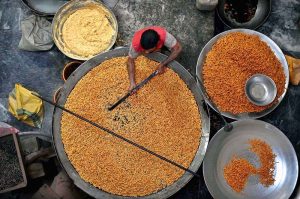 Workers busy in frying traditional food Pakoriyaa mostly used in Dahi Bhalle during the holy fasting month of Ramazan