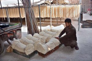Workers dry vermicelli (sawian) under the sun to meet market demand at his workplace during the holy month of Ramazan.