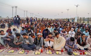 A large number of people break their fast at a free Iftar point along the expressway near PWD in the holy month of Ramazan ul Mubarak.