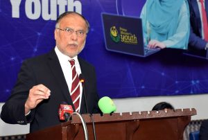 Federal Minister for Planning and Development Ahsan Iqbal addresses a ceremony under the Prime Minister’s Laptop Scheme.