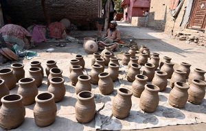 Worker busy preparing clay made stuff at his work place near Kumharpara