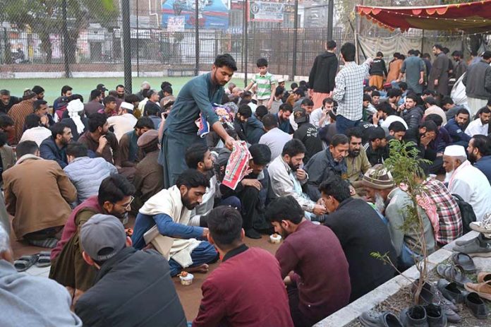 A large number of people break their fast distribute by volunteers at Commercial Market during holy month of Ramazan ul Mubarak