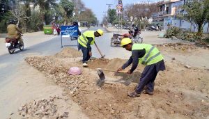 Laborers are busy excavating the road at Hussain Chowk to lay new sewerage pipes.