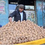 A volunteer preparing drinks for people during Iftar to break their fast in the Islamic month of Ramazan.
