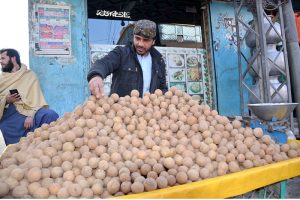 A volunteer preparing drinks for people during Iftar to break their fast in the Islamic month of Ramazan.
