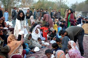 A large number of people from slum area receiving food to break their fast at a free Iftar reception by AWP in the holy month of Ramazan ul Mubarak.