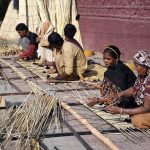 Workers preparing traditional curtain (chick) at radio Pakistan road