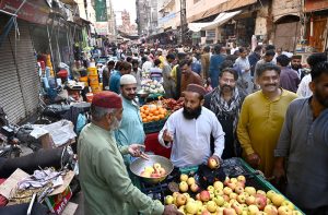 A worker prepares freshly made jalebi, a traditional sweet for iftar, during the holy month of Ramazan at Tower Market