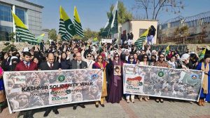Chairperson Peace and Culture Organization Mushaal Hussein Mullick and Farah Naz Akbar, Parliamentary Secretary for Federal Education and Professional Training, lead a walk with students, while banners are displayed in connection with Kashmir Solidarity Day at the FG Institute of Home Economics, Arts and Design, F-11/1 Hilal Road.
