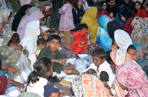 A large number of people from slum area receiving food to break their fast at a free Iftar reception by AWP in the holy month of Ramazan ul Mubarak.