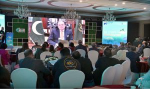 Federal Minister for Finance and Revenue Muhammad Aurangzeb addressing through video link at the Pakistan Climate Conference 2026, organized by the Overseas Investors Chamber of Commerce and Industry (OICCI), at a local hotel