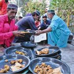Volunteers arranging food for iftrari for deserving people at Cantt Station
