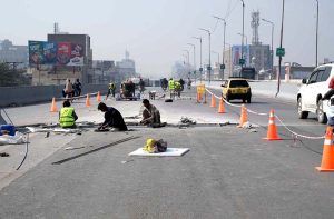 Laborers are busy repairing Gulbahar Flyover during repairing and maintenance work in the Provincial Capital.