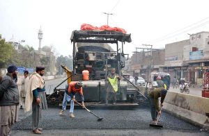 Heavy machinery being used during road construction work at Sheikhupura Road.
