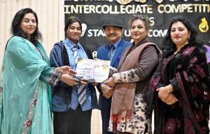 Famous TV Artist Amjum Habibi and Principal Prof. Abida Parveen awarding certificates to position holder students during prize distribution ceremony of Standup Comedy & Embroidery competitions held at Model College for Girls Bharakahu.
