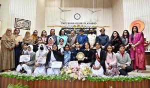 Famous TV Artist Amjum Habibi and Principal Prof. Abida Parveen awarding certificates to position holder students during prize distribution ceremony of Standup Comedy & Embroidery competitions held at Model College for Girls Bharakahu.