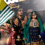 A girl in a traditional Kashmiri dress to express solidarity with Kashmiris as a part of Kashmir Solidarity Day at Faisal Chowk.