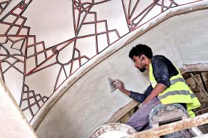 An interior view of workers engaged in the restoration work of the historic Anarkali Tomb, a 16th-century Mughal architectural landmark.