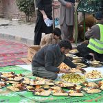 Volunteers arranging Iftar for common people to break their fast along the roadside in the holy month of Ramazan ul Mubarak