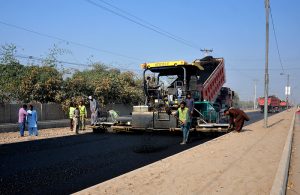 Workers and heavy machinery busy in asphalt carpeting during ongoing construction work on the Multan-Vehari Road under the 93-95 km dualization project. The Rs 25 billion mega infrastructure initiative, scheduled for completion by June 2026, will provide a modern, dust-free roadway and improve connectivity of four districts with the M-4 motorway, facilitating smoother traffic flow and regional economic development.