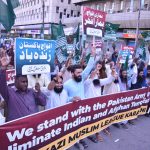 Activists of the Central Muslim League hold a rally in support of the Pakistan Army outside the Karachi Press Club.