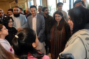 Federal Minister for Information Technology and Telecommunication Shaza Fatima Khawaja interacting with students on the occasion of women hackathon under Indus AI Week 2026 at Zaitoon IT Park of Saylani Welfare International Trust