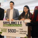 Federal Minister for Information Technology and Telecommunication Shaza Fatima Khawaja with Special Assistant to the Chief Minister Sindh for Science and Information Technology Department Government of Sindh, Mr. Ali Rashid handing over a cash prize to a winner of women hackathon under Indus AI Week 2026 at Zaitoon IT Park of Saylani Welfare International Trust