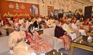 Newlywed couples offer prayers during a mass marriage ceremony at Paradise Marquee, Sheikhupura Road, where 111 couples tied the knot under the “Punjab Dhi Rani Program.”