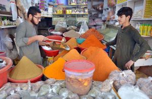 Vendor selling and displaying variety of spices ahead of Ramadan at Mandi area.