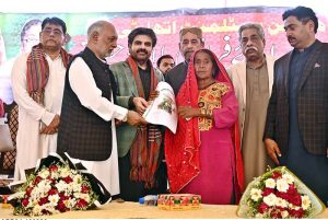 Sindh Minister for local government Syed Nasir Hussain Shah distribute ownership certificates among slum dwellers at SRTC ground.
